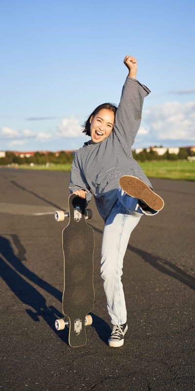 vertical-shot-of-asian-girl-feeling-excited-skati-2025-03-05-05-53-10-utc vertical-shot-of-asian-girl-feeling-excited-skati-2025-03-05-05-53-10-utc